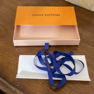 Louis Vuitton glove, wallet, scarf box with ribbon and tissue.